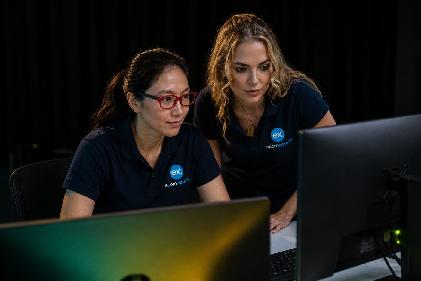 Two EcomExperts specialists analysing technical SEO site data